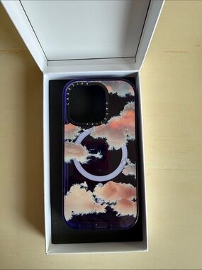 Casetify Purple iPhone 14 Pro Mag Safe Case with Pink and White Clouds